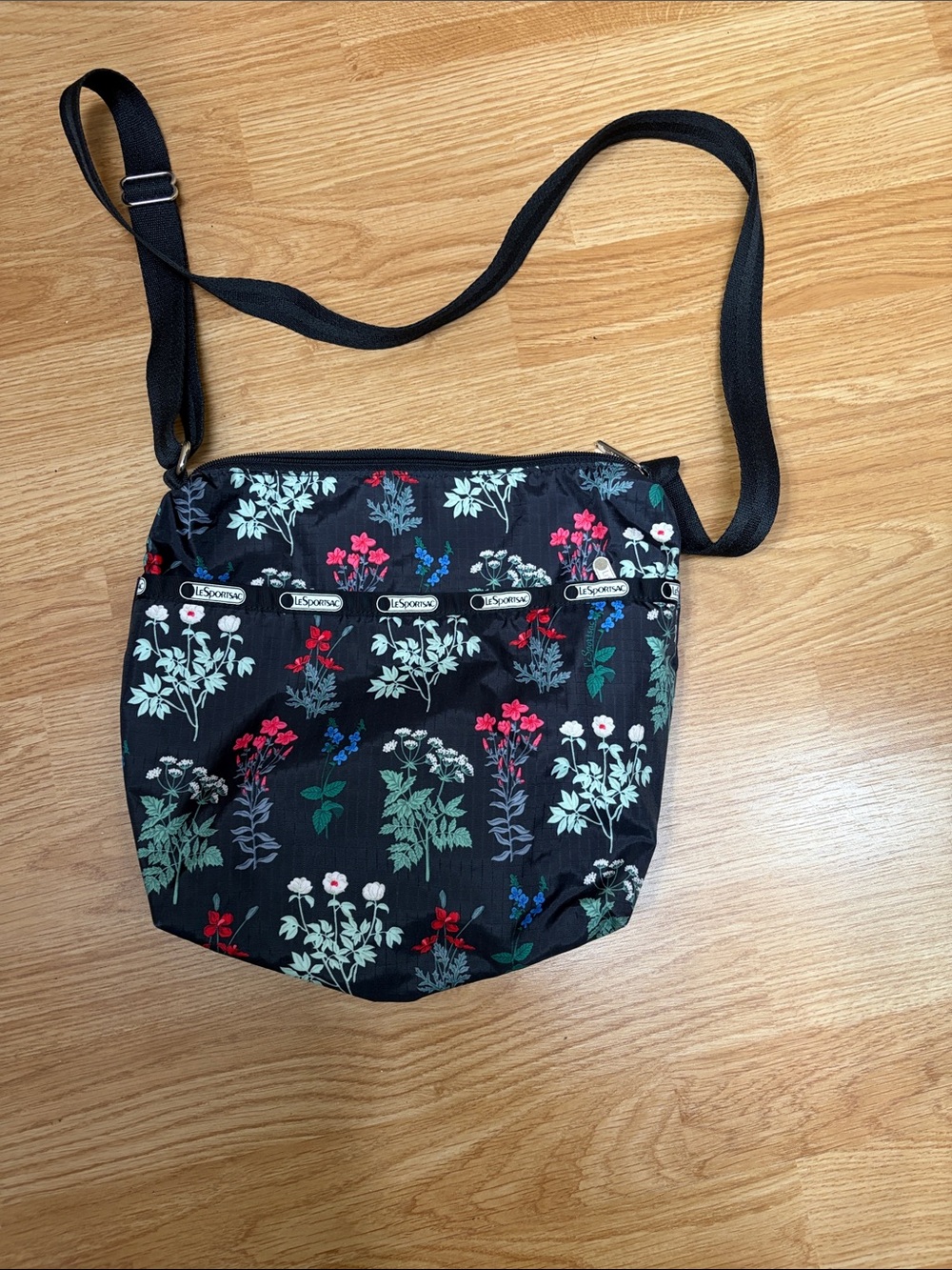NWOT Lesportsac Black Floral Crossbody with Red, Green & White Accents